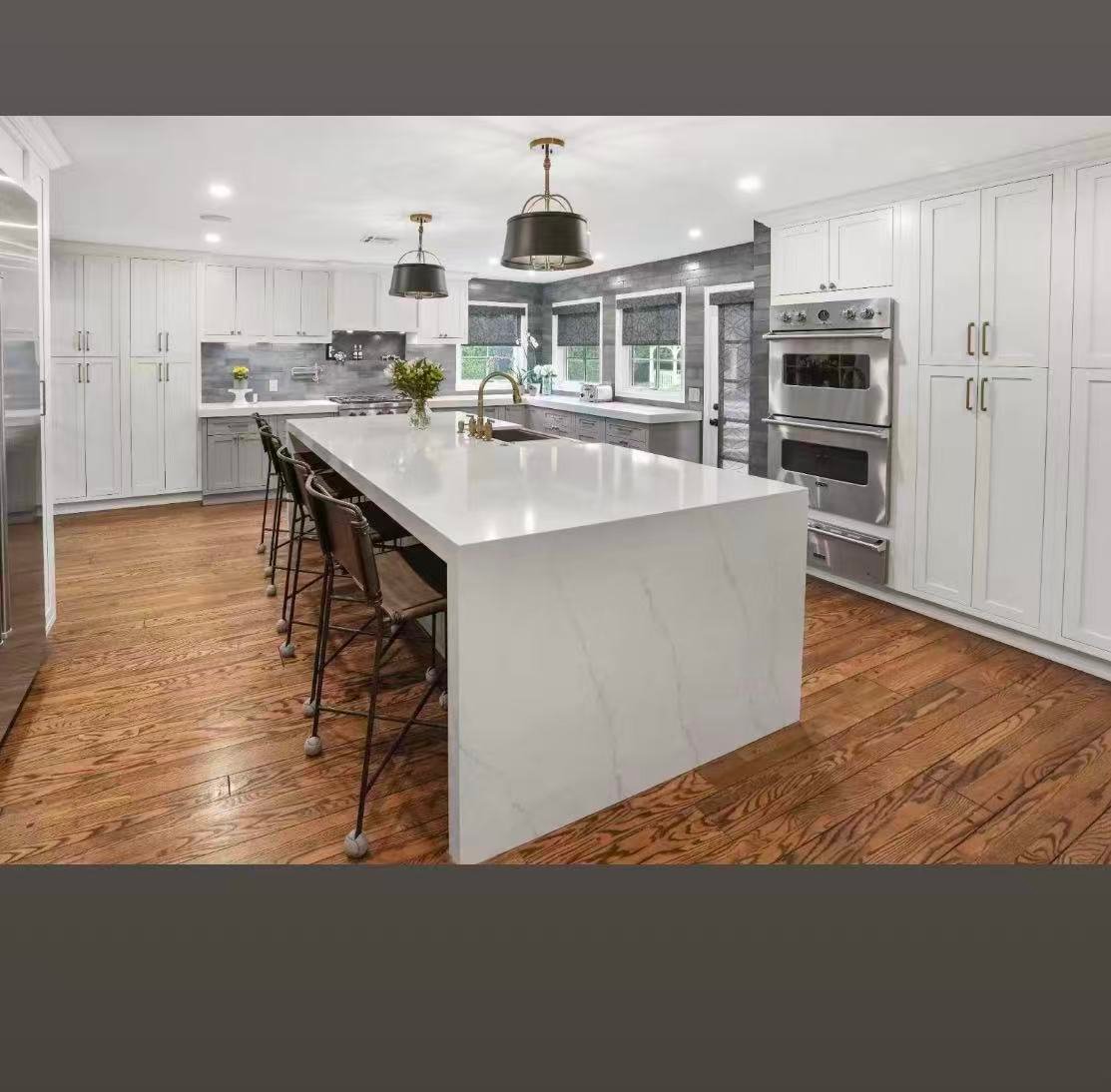 Large white island kitchen remodel with upgraded cabinetry and open layout